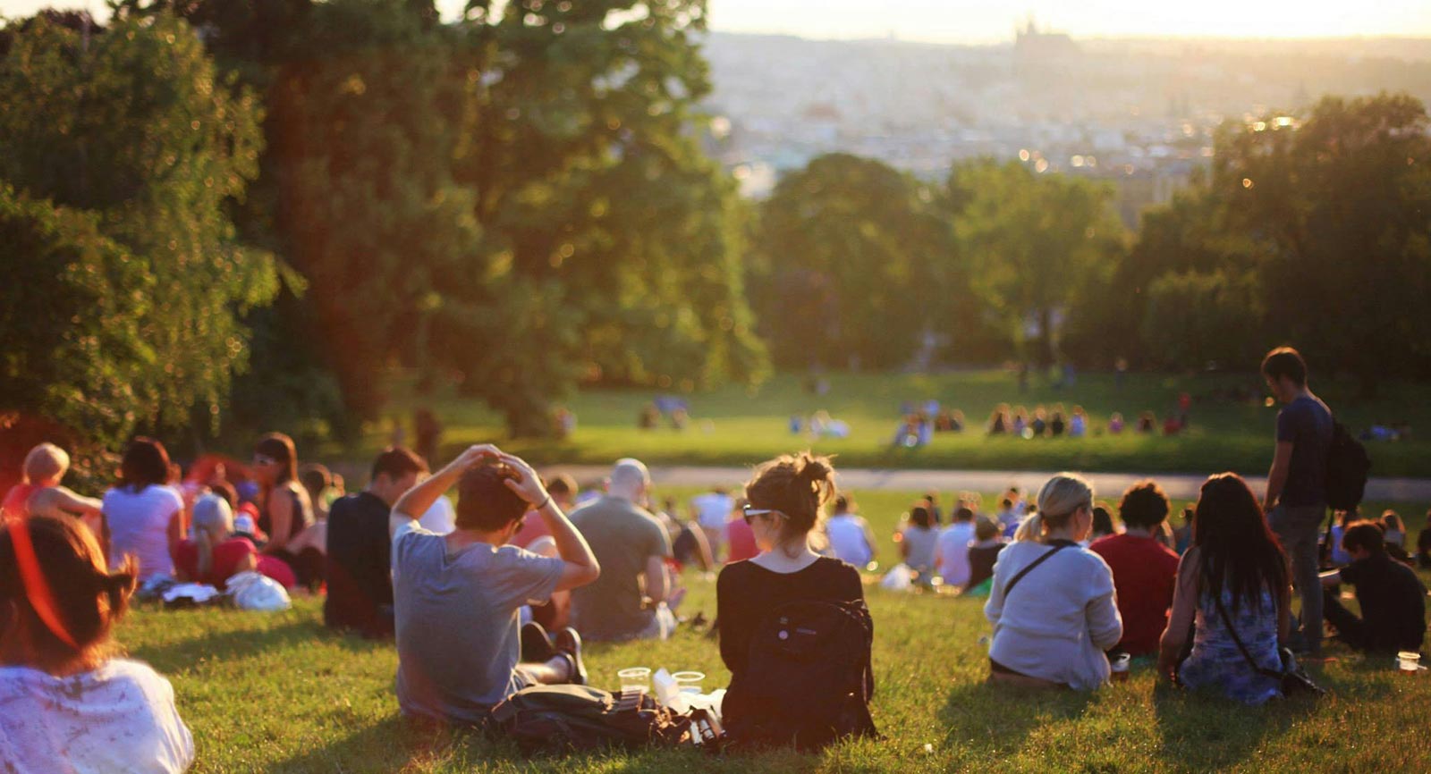 A group of people spend time outside at the park.