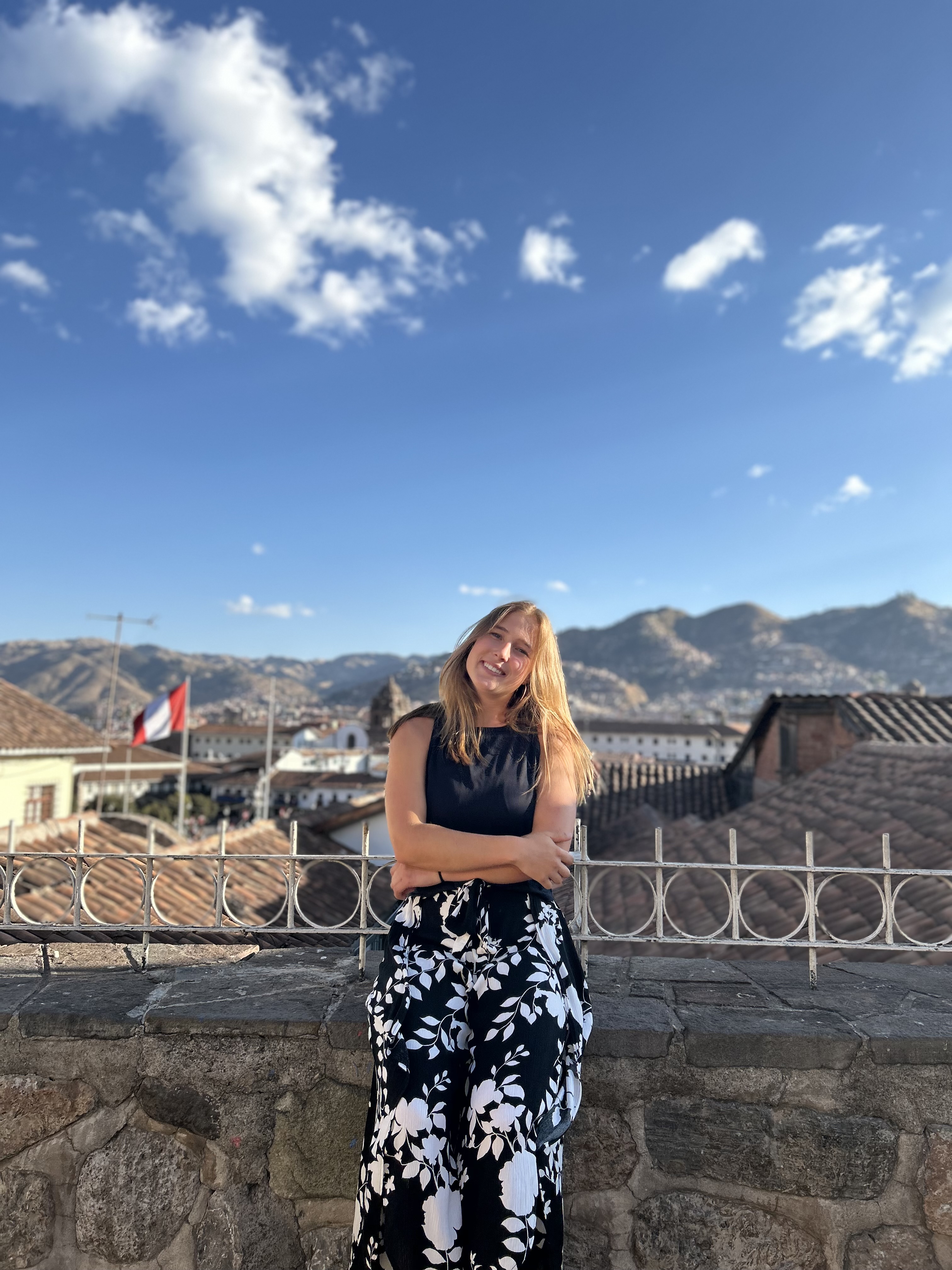 Morgan Yeiser posing in front of a scenic landscape