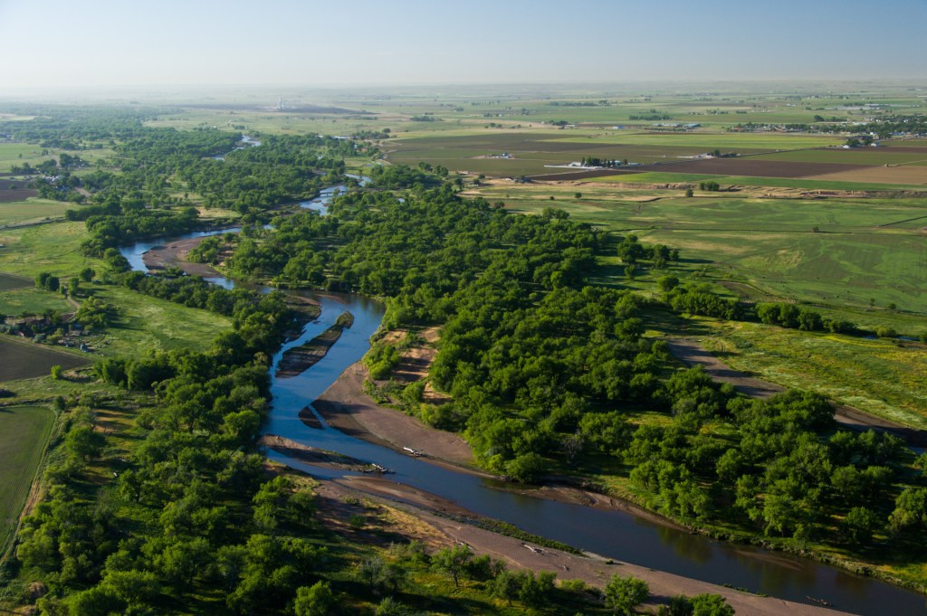 An aerial view of the Colorado River and Orchard Mesa from above Palisade, Colorado.