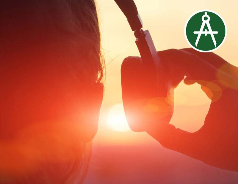 A person wearing headphones while watching the sunset, with a warm glow filling the scene. The Applied logo podcast is present in the top right corner.

