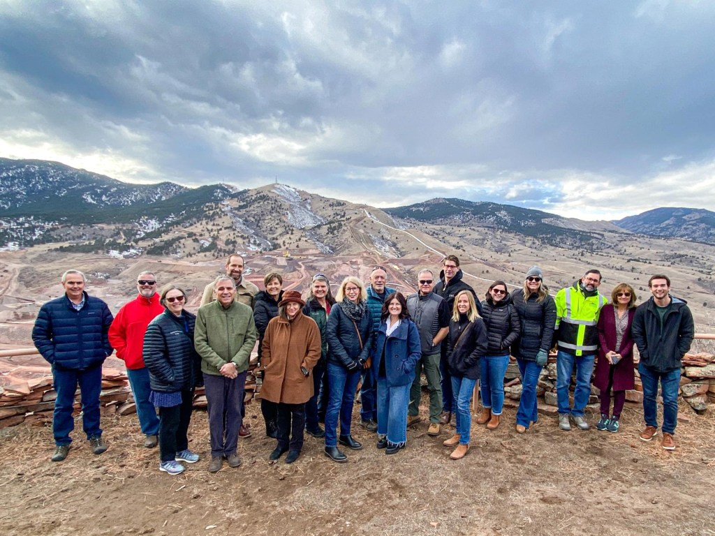 A group of donors stand for a picture at Chimney Hollow.