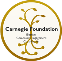 A circular badge from the Carnegie Foundation with golden tree branches, indicating Elective Community Engagement Classification.